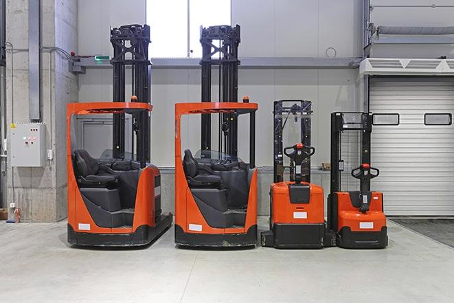 forklifts moving goods in a distribution center